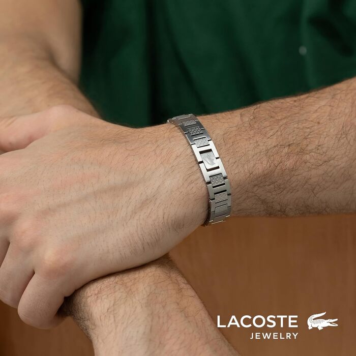 Спортивний браслет Lacoste Metropole сріблястого кольору з візерунком petit piqué та застібкою-затискачем, унісекс