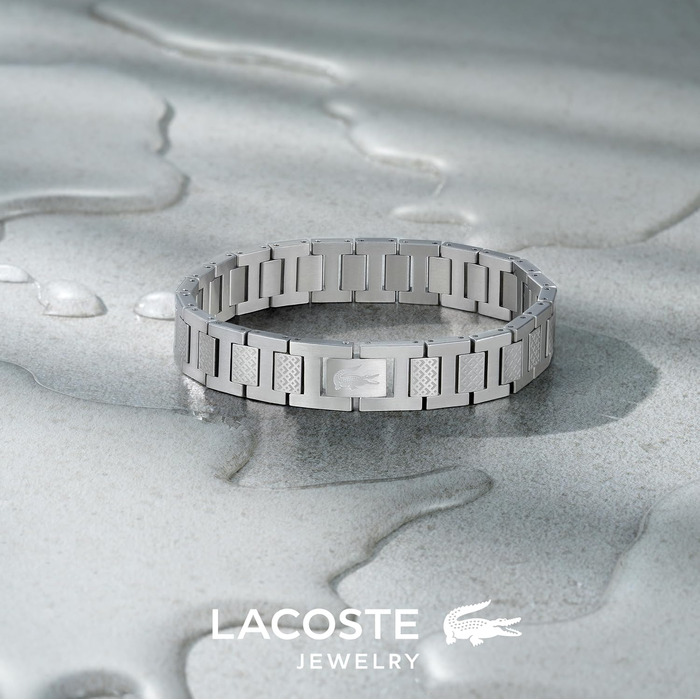 Спортивний браслет Lacoste Metropole сріблястого кольору з візерунком petit piqué та застібкою-затискачем, унісекс